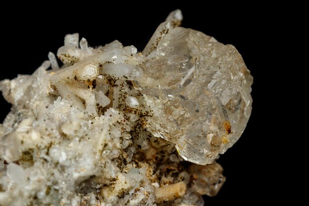 Macro mineral stone fluorite with quartz against black background