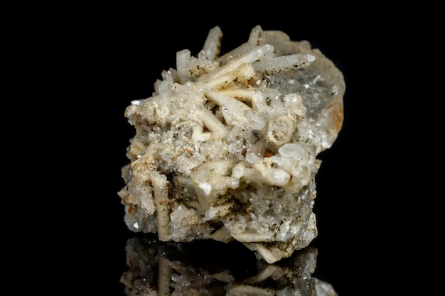 Macro mineral stone fluorite with quartz against black background