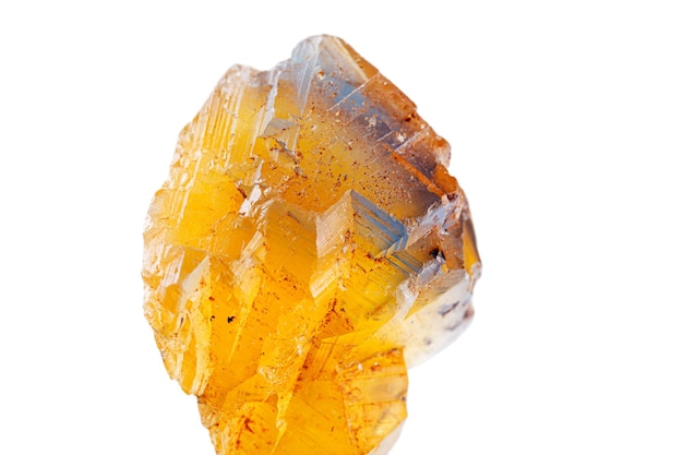 Photo macro mineral stone fluorite yellow and blue color on a white background closeup