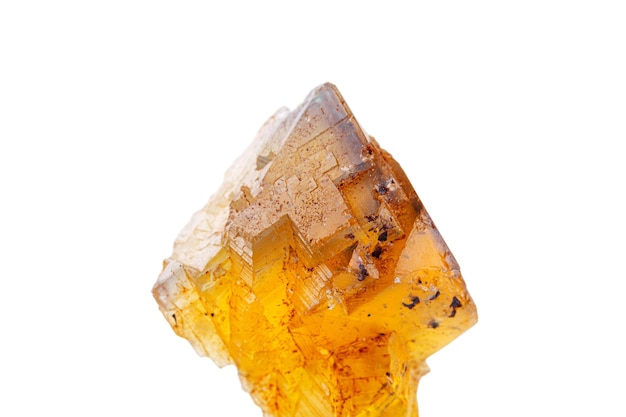 Macro mineral stone Fluorite yellow and blue color on a white background closeup