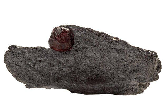 Macro mineral stone Garnet in rock on a white background