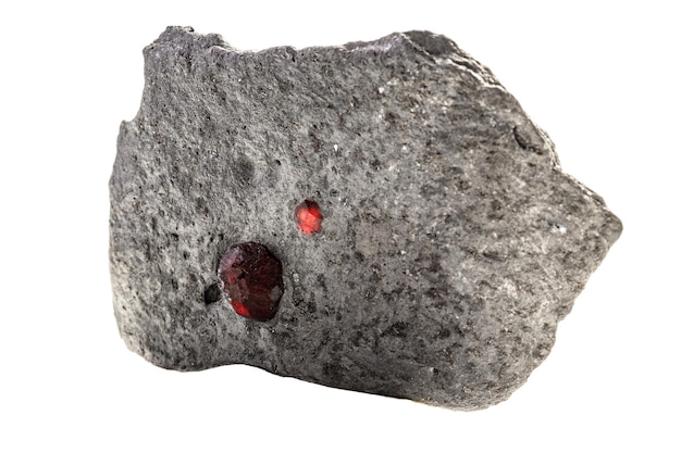 Macro mineral stone Garnet in rock on a white background