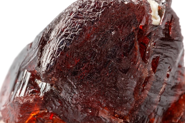 Macro mineral stone Garnet Spessartine on a white background