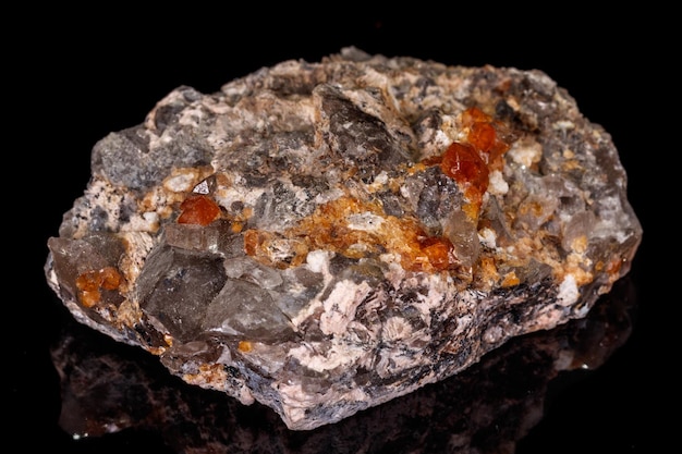 Macro mineral stone Grossular Garnet Epidote on a black background
