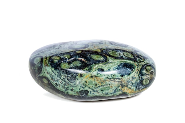 Macro mineral stone jasper kambaba on a white background