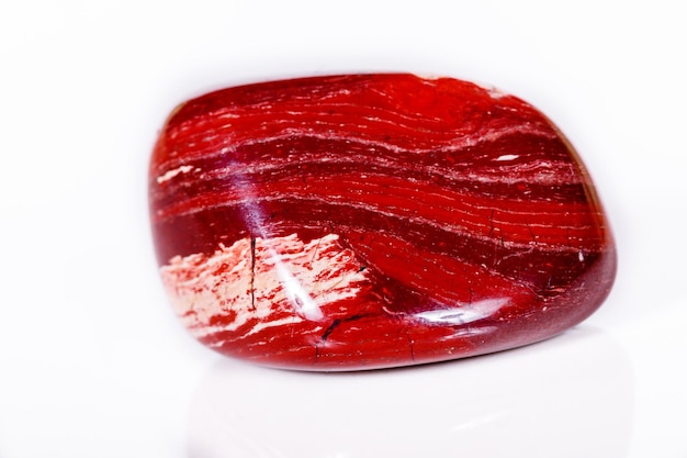 Macro mineral stone jasper zebra iron on a white background