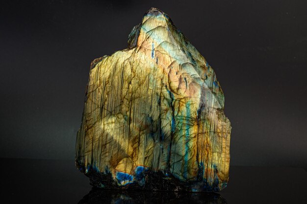 Macro mineral stone labradorite on a black background