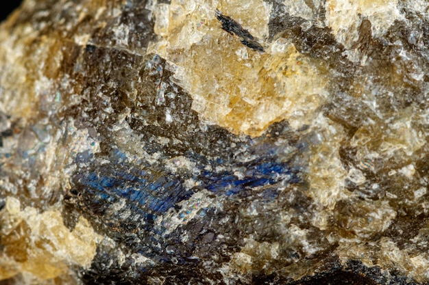 Macro mineral stone Labradorite on a black background