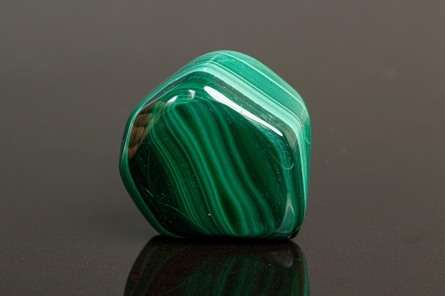 Macro mineral stone malachite on a black background