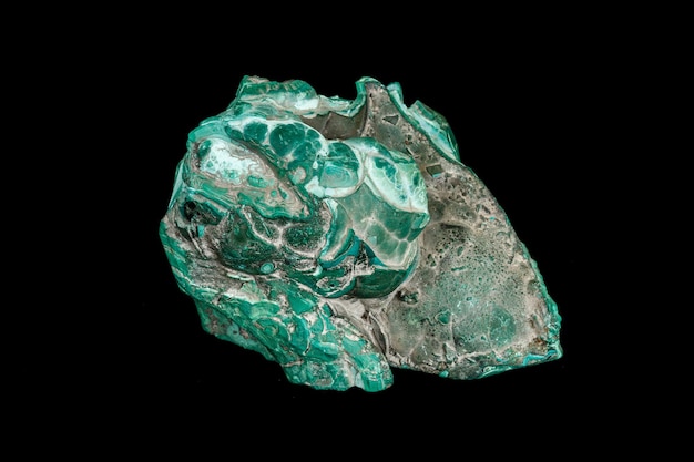 Macro of a mineral stone Malachite on a black background