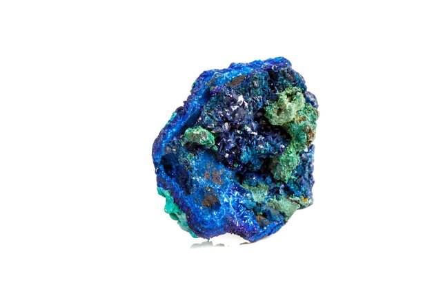 Macro mineral stone malachite with azurite on white background