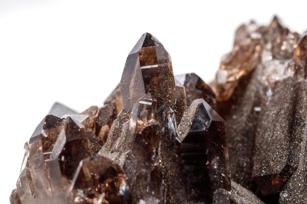 macro mineral stone morion crystal in the rock a white background