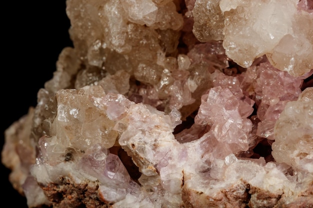 Macro mineral stone Pink Amethyst on a black background