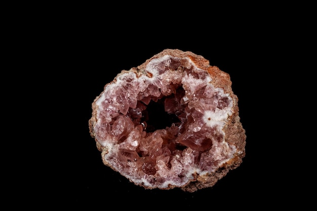 Macro mineral stone Pink Amethyst on a black background