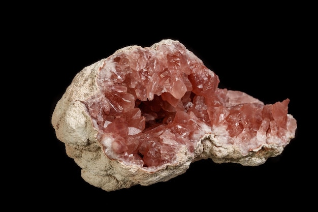 Macro mineral stone Pink Amethyst on a black background