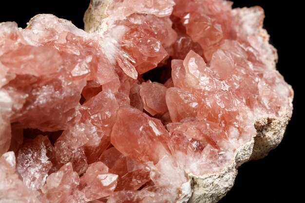 Macro mineral stone Pink Amethyst on a black background