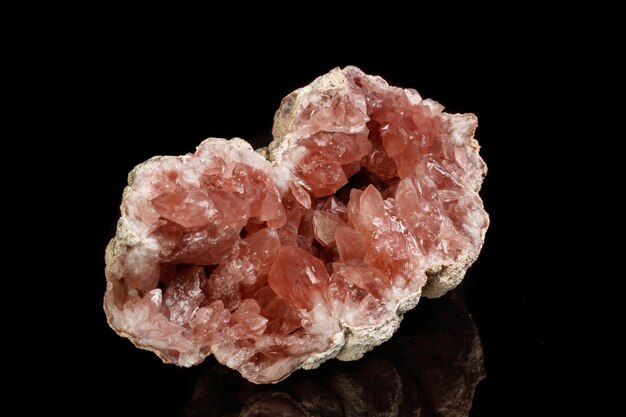 Macro mineral stone Pink Amethyst on a black background