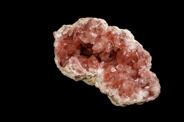 Macro mineral stone Pink Amethyst on a black background