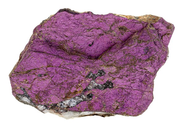 Macro mineral stone purpureus purple purpurite in the breed a white background