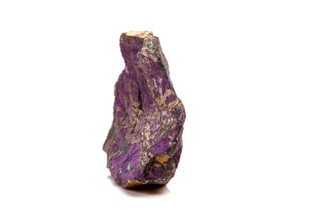 Macro mineral stone purpureus purple purpurite in the breed a white background