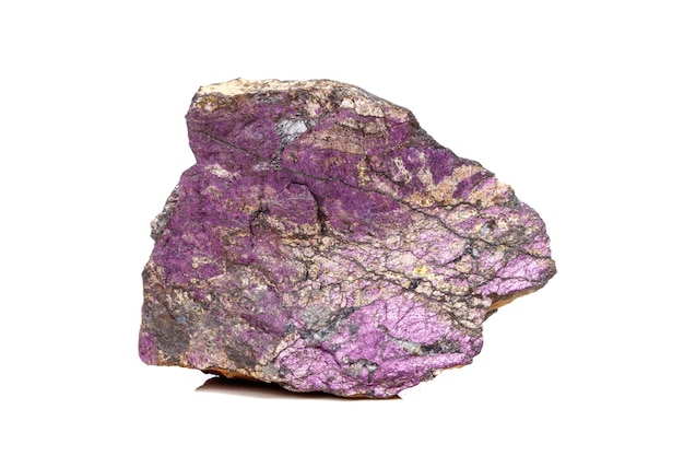 Macro mineral stone purpureus purple purpurite in the breed a white background