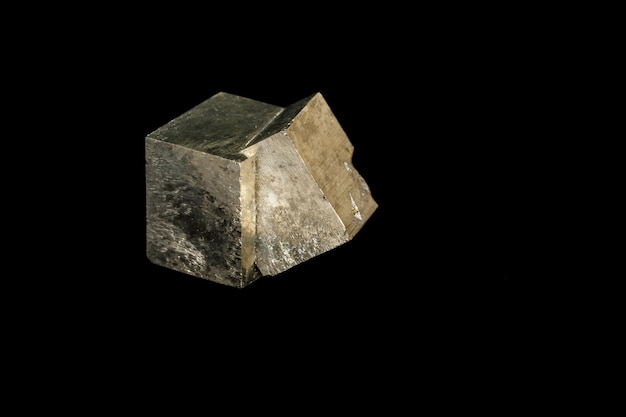 Macro mineral stone Pyrite on a black background