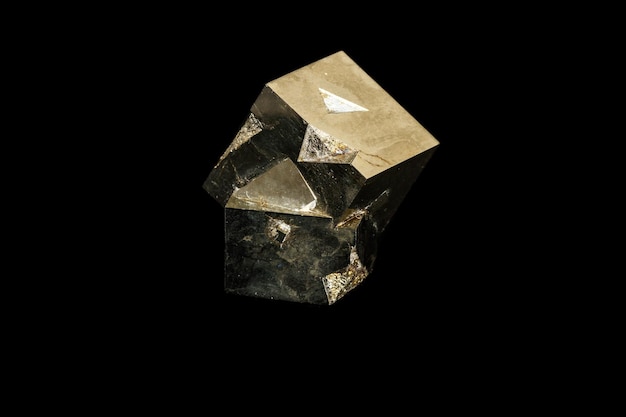 Macro mineral stone Pyrite on a black background