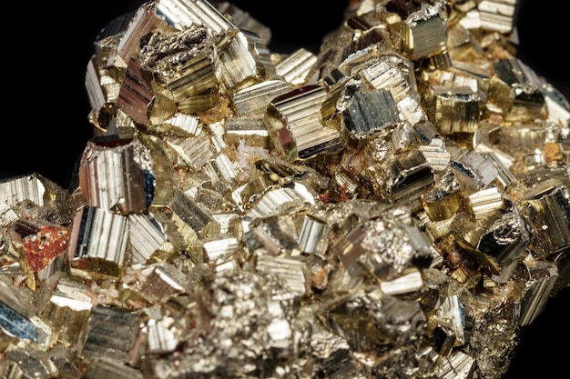 Macro mineral stone Pyrite on a black background