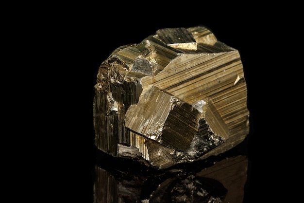 Macro mineral stone Pyrite on a black background