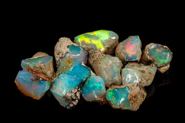 Macro mineral stone rare and beautiful opals on a black background