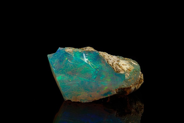 Macro mineral stone rare and beautiful opals on a black background