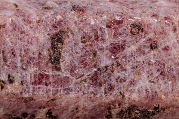 Macro mineral stone Ruby in the breed a white background