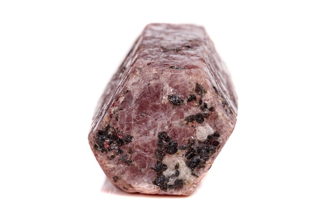 Macro mineral stone Ruby in the breed a white background