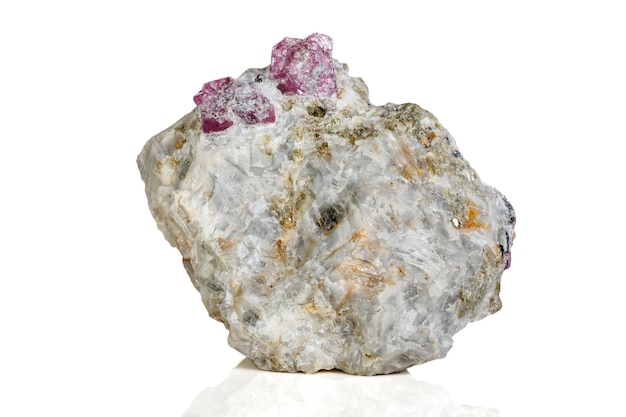 Macro mineral stone Ruby in rock on white background