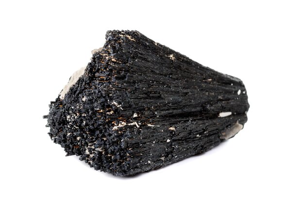 Macro mineral stone Schorl Black Tourmaline on a white background