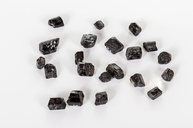 Macro mineral stone schorl black tourmaline on white background