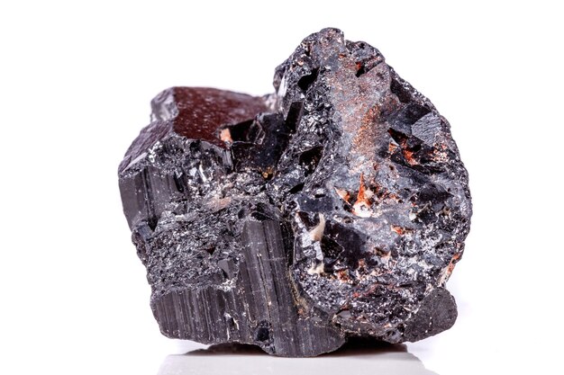 Macro mineral stone sherle schorl black tourmaline on white background