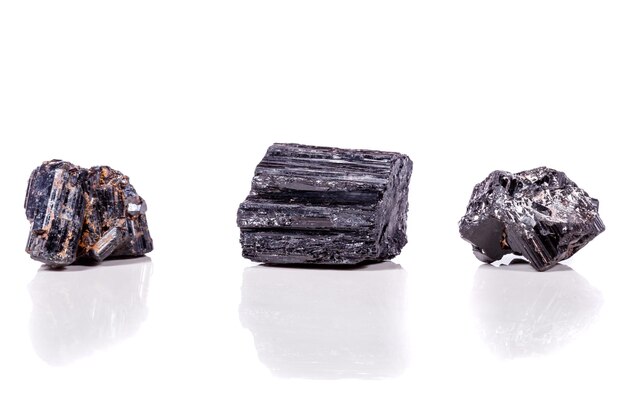 Macro mineral stone sherle schorl black tourmaline on white background