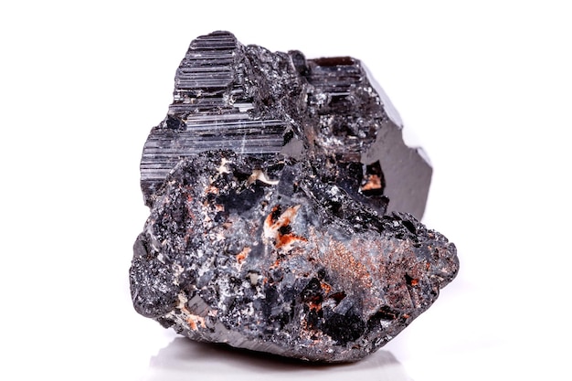 Macro mineral stone sherle schorl black tourmaline on white background