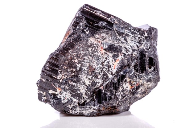 Macro mineral stone sherle schorl black tourmaline on white background