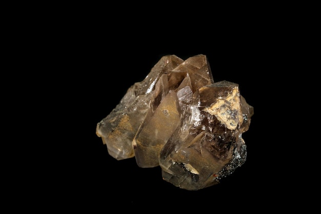 Macro mineral stone smoky quartz rauchtopaz on a black background