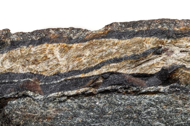 Макроминеральный камень Змеиный глаз в скале на белом фоне