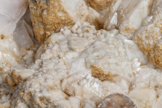 Macro mineral stone Snow quartz with calcite on a black background