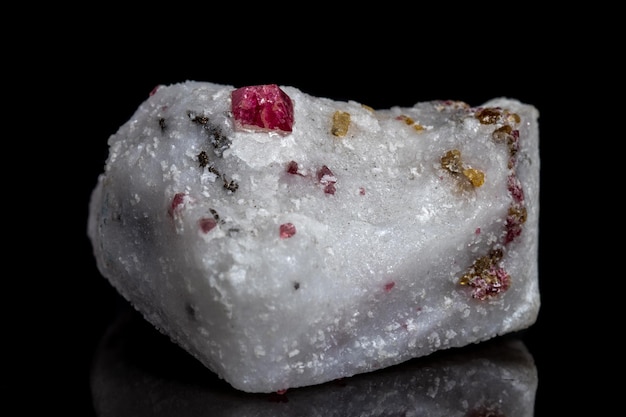 Macro mineral stone Spinel on a black background