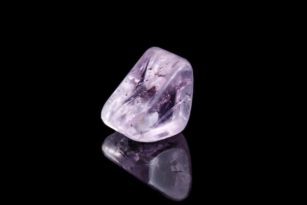 Macro mineral stone spodumene kunzite black background