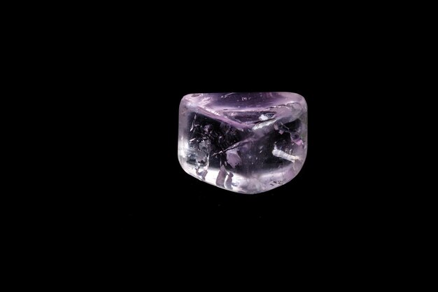 Macro mineral stone spodumene kunzite black background