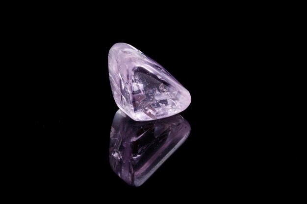 Macro mineral stone spodumene kunzite black background