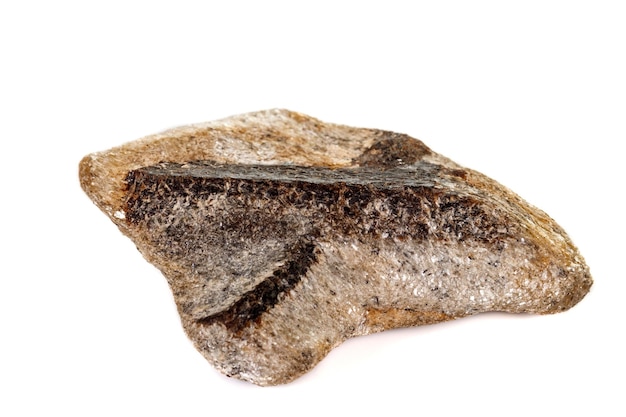 Macro mineral stone Staurolite on a white background