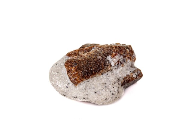 Macro mineral stone Staurolite on a white background