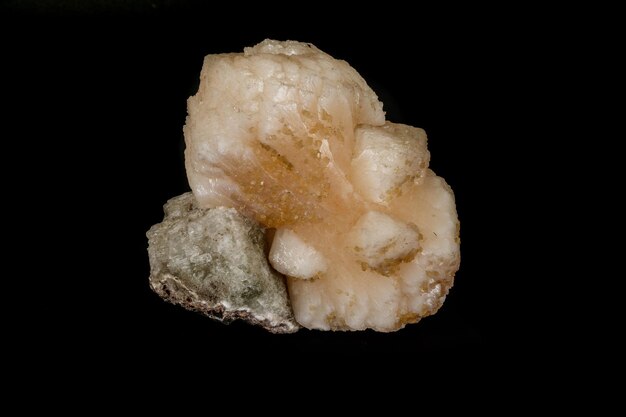 Macro mineral stone Stilbite on Apophyllite on a black background